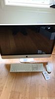 Front view of iMac with keyboard and mouse