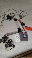 Overhead view of NES console, controllers, zapper, cartridge, power adapter and AV cable