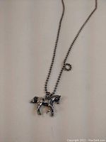 Full view of the 35 inch beaded sterling silver necklace with horse pendant