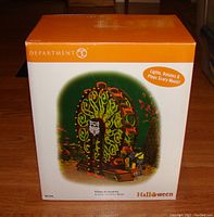 Original box for Department 56 Halloween Scaredy Cat Ferris Wheel showing product image and branding.