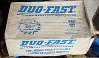 Cardboard box labeled Duo-Fast with branding and product description as full round head strip nails.
