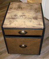 Front and top view of the double drawer cabinet showing wood top and cloth drawers with antique bronze handles