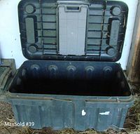Open large black storage box showing spacious interior