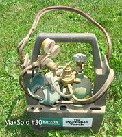 Molded plastic carrying case holding two gas cylinders, hoses and regulators