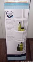 Front of the box showing Zenna Home branding and product features: tension corner caddy, large capacity, rust resistant, adjustable shelves, white finish.