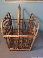 Front and top view of vintage bamboo book or magazine holder showing divided compartments and bamboo construction.