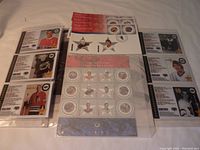 Set of six hockey player stamp cards in custom sheet with stats on back