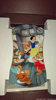 Disney Snow White and Seven Dwarfs collectible plate inside protective packaging