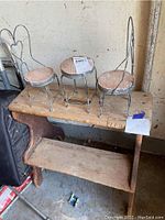 Three tall wire-framed chairs with wooden seats on rectangular wooden step/stand showing overall lot items