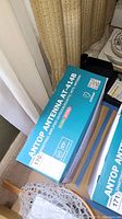 Box of Antop AT-414B antenna showing branding and model information