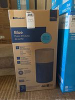 Image of sealed Blueair Blue Pure 311 Auto air purifier box showing product branding and model details.