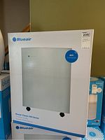 Front view of Blueair Classic 600 Series air purifier in box showing product image and WiFi connected label