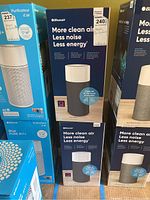 Boxes showing Blueair Blue Pure 411 air purifiers with product details and branding.