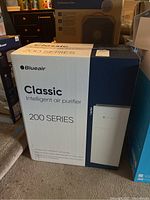 Full view of Blueair Classic 200 Series Intelligent air purifier packaging box showing front design and branding.