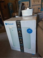 Boxed Blueair Classic 200 Series air purifier showing front view with WiFi Connected icon and Amazon Prime branding tape.