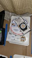 Photo showing the Razor Sharp Edgemaking System components and Altilinq Altimeter & Barometer on top of the box.