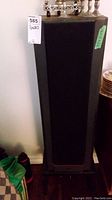 Photo of one PSB floor standing speaker showing its height and housing on stand.