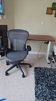 Overview of desk and Aeron chair in room setting