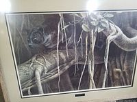 Framed print showing a black panther in the banyan tree environment, detailed and realistic artwork.