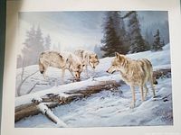 Full view of the signed and numbered print showing three wolves in a snowy forest scene.