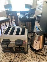 Photo of Comfee rice cooker, Hamilton Beach 4-slot toaster, and Hamilton Beach electric kettle on kitchen counter