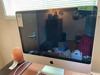 Front view of iMac showing display, stand and general condition