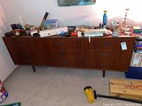 Full view of dresser with items on top