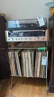 Full setup with turntable, receiver, metal stand and vinyl records