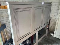 Matte gray queen panel headboard showing paneled design and clean lines