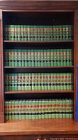 Bookshelf with four rows of green hardbound Maryland Appellate Reports volumes from 1 to 57.