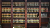 Full view of large shelving unit filled with numerous volumes of law books including Maryland Reporter, Shepard's Maryland Citations, and Annotated Code of Maryland volumes