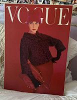 Front of canvas print showing Audrey Hepburn on Vogue cover with red background and white Vogue lettering