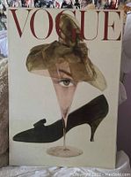 Front view of Vogue canvas print showing pop art collage with Audrey Hepburn's face, shoe, and wine glass elements