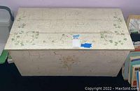 Top view showing crackle paint and ivy design on toy chest lid