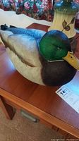 Front and side views of the signed mallard wood duck decoy showing detailed paint, colors, and overall shape.