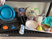 Overview of all items including drying rack, dishes, Brita filter, colander, pitcher, serving tray, and some decorative pieces.