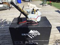 Model on top of original Bucyrus box showing overall appearance and box branding