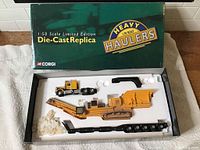 Full view of the Corgi Heavy Haulers box with Kenworth truck, trailer, and rock crusher load laid out in white foam insert.