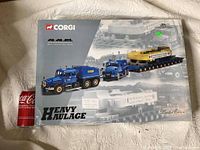 Limited edition boxed Corgi Heavy Haulage model showing the truck and trailer image with blue truck and yellow load.