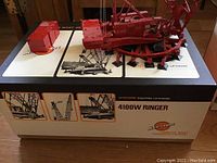 Model crane and counterweight on top of display box