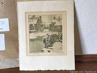 Aquatint artwork showing the signed print 'Silent Wheels' by Nicholas Hornyansky on textured paper with visible deckled edges and snow-covered water wheels.