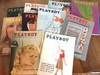 Playboy magazines arranged in overlapping layout showing various vintage covers from 1950s and 1960s.