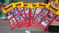 Sixteen Donruss Baseball Puzzle and Cards packages, mostly sealed, each showing the yellow and red packaging design with photos of baseball players. Packs appear to contain 72 cards and 12 puzzle pieces each.