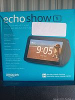 Front of Amazon Echo Show 5 box showing 5.5 inch screen and Alexa functionality