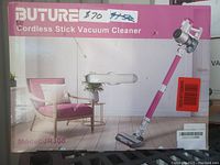 Front view of boxed Buture cordless stick vacuum cleaner, model JR300, showing branding and product image on box.