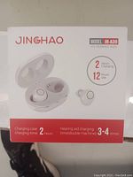 Photo of the product box showing Jinghao JHA39 hearing aids and charging case with product details.