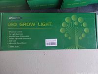 Box labeled SEEMAI LED Grow Light with specifications and features listed on front.