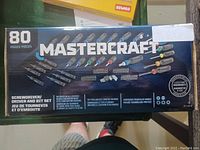 Top view of Mastercraft 80 piece screwdriver, driver and bit set box showing various bits and handle.