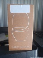 Front of the box showing a line drawing of the Nooie Cam 360 camera and brand name.