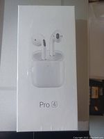 Boxed Pro 4 wireless earbuds with charging case, white earbuds pictured on front of package.